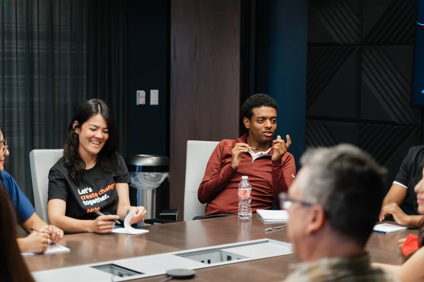 HighView students in a discussion with mentors around a boardroom table