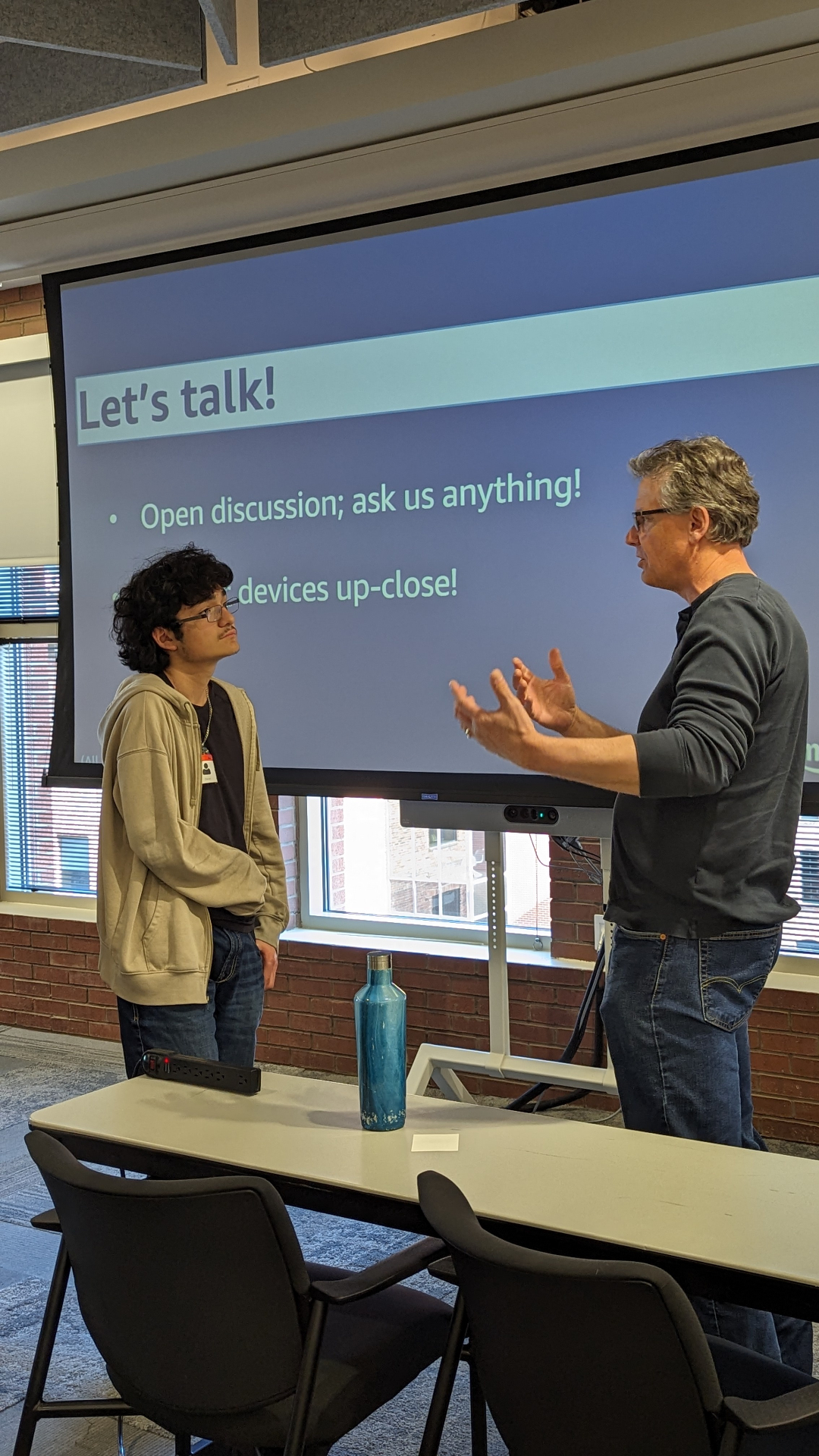 HighView student refining his elevator pitch with a mentor at Amazon's office