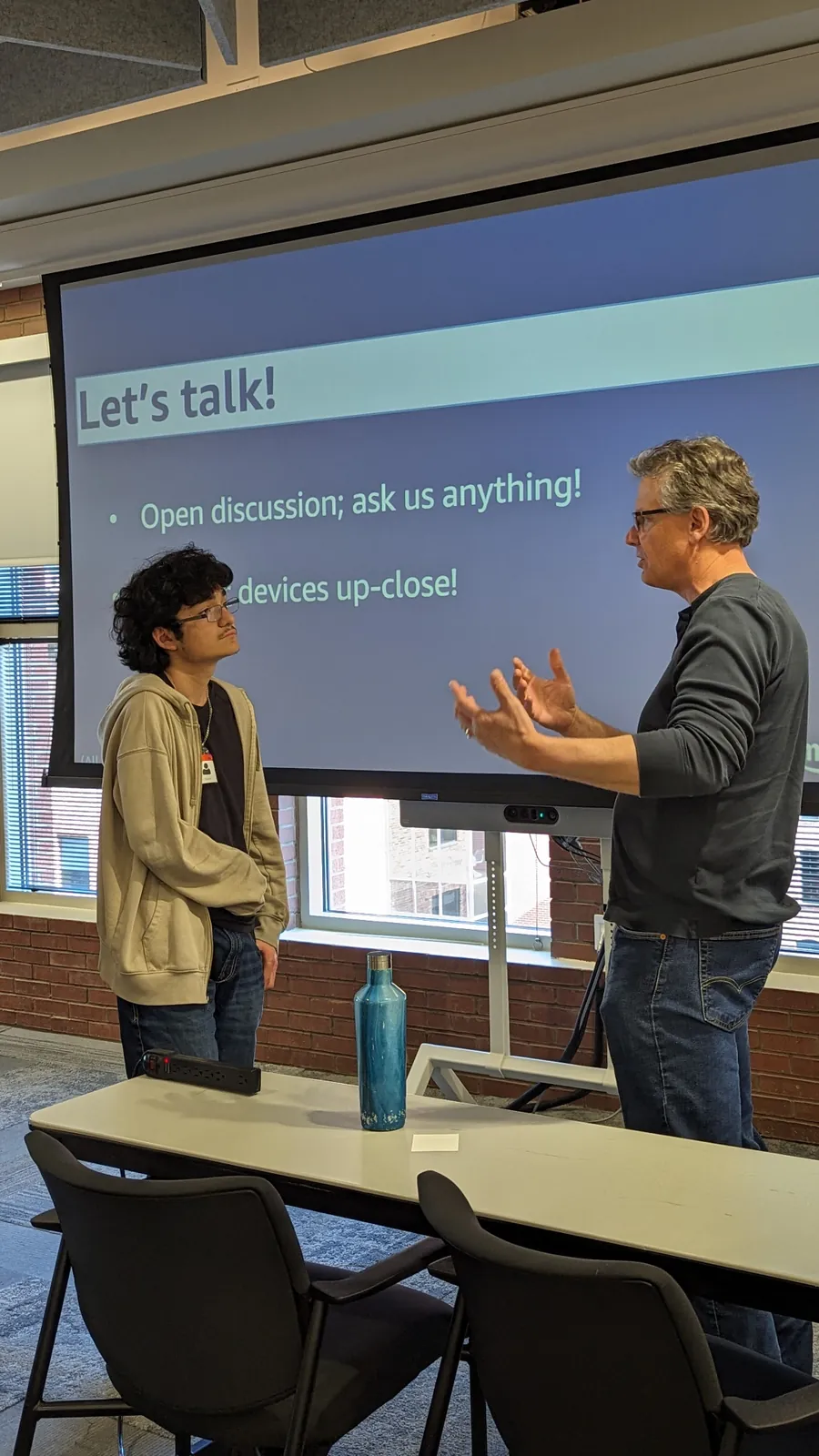 HighView student refining his elevator pitch with a mentor at Amazon's office