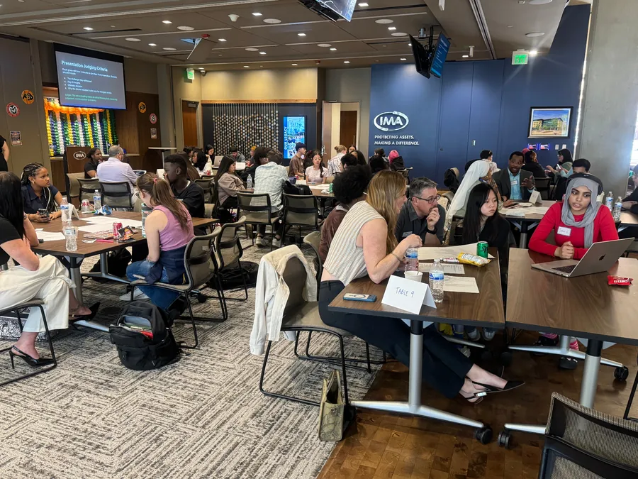 HighView students working on a critical thinking challenge at IMA Financial